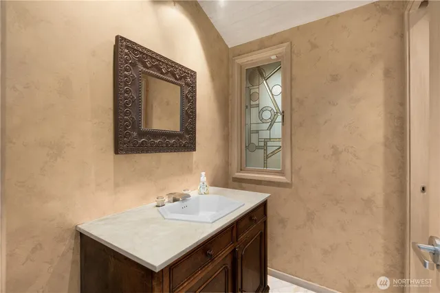a bathroom with a sink and a mirror