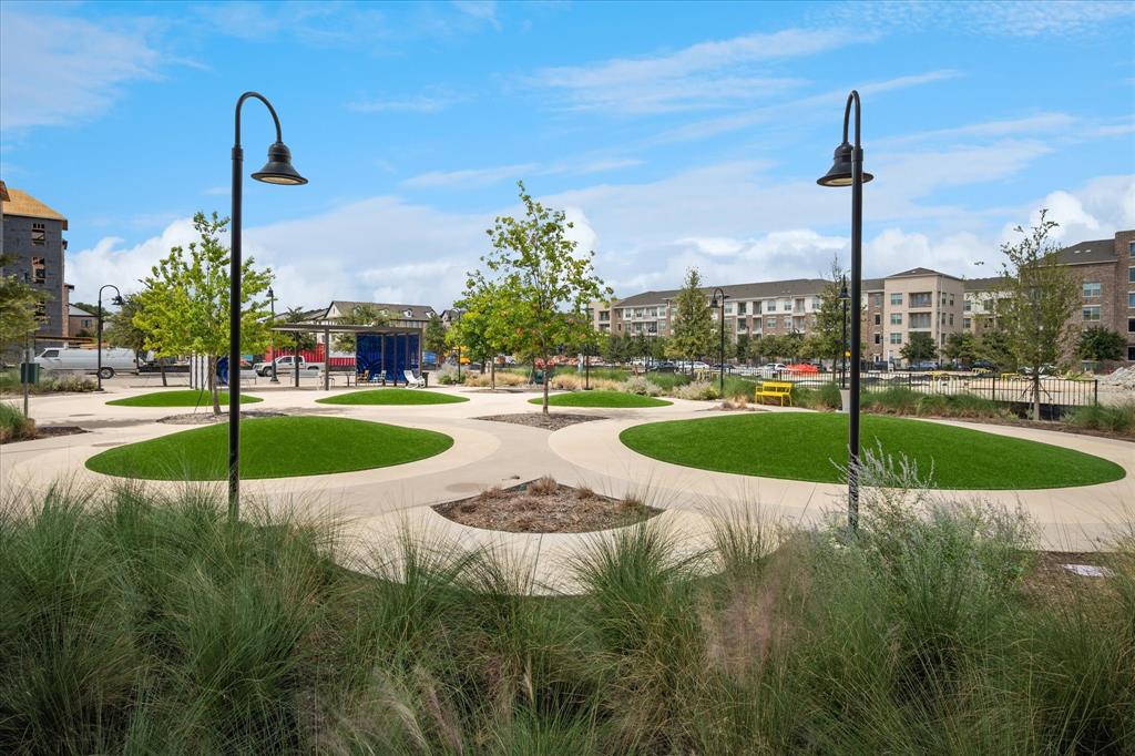 14954 Oak Street Addison, TX 75001 - Photo 10 of 18 a view of a swimming pool with a yard