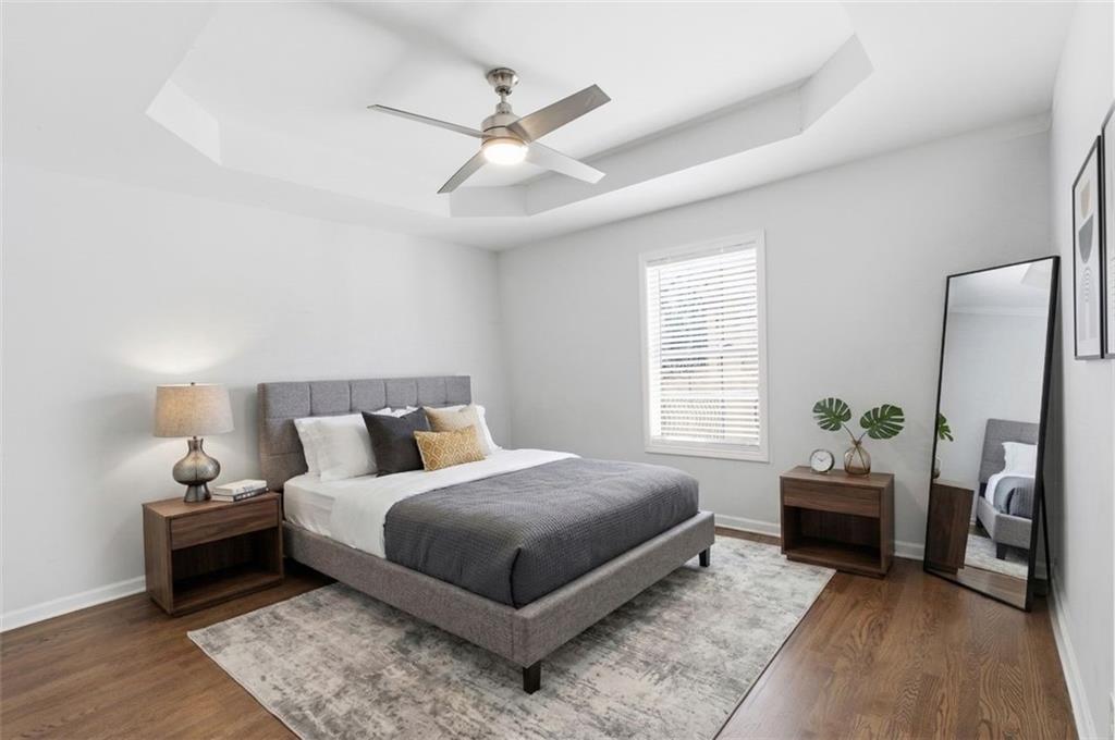 85 Meldon Avenue Southeast Atlanta, GA 30315 - Photo 12 of 39 a bedroom with a bed and a chandelier