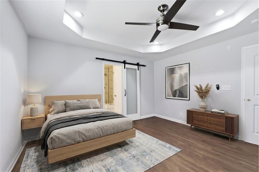 85 Meldon Avenue Southeast Atlanta, GA 30315 - Photo 16 of 39 a bedroom with a bed and a chandelier