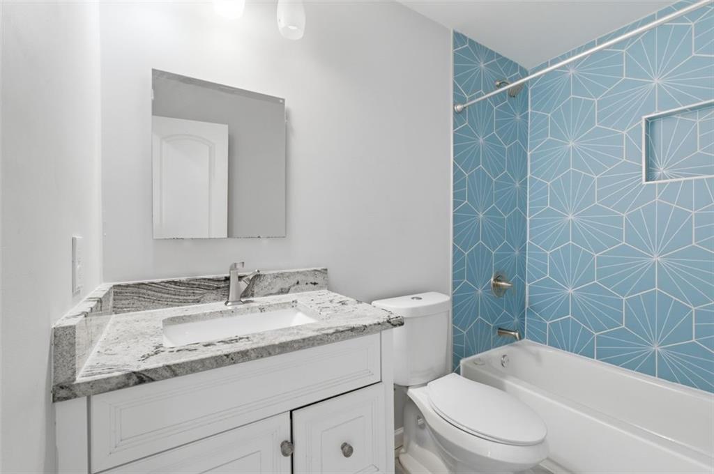 85 Meldon Avenue Southeast Atlanta, GA 30315 - Photo 20 of 39 a bathroom with a granite countertop sink toilet and shower