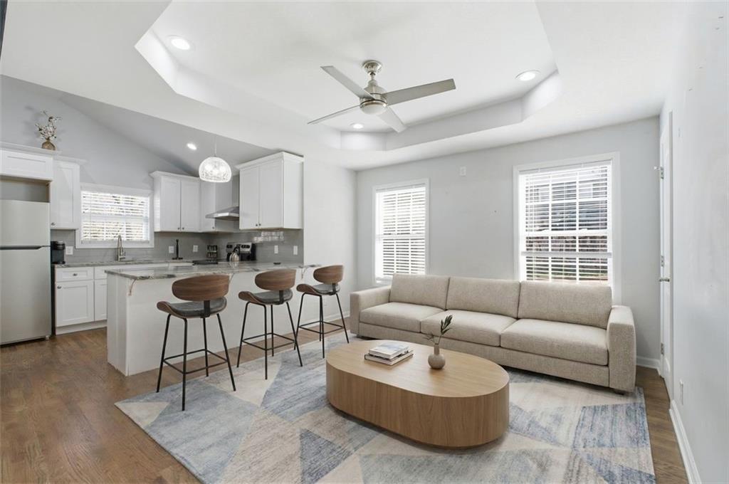 85 Meldon Avenue Southeast Atlanta, GA 30315 - Photo 21 of 39 a living room with furniture a kitchen view and a window