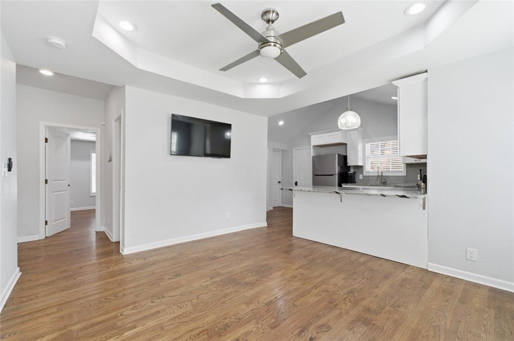 85 Meldon Avenue Southeast Atlanta, GA 30315 - Photo 24 of 39 a view of a living room a kitchen and a wooden floor