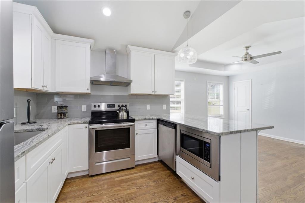 85 Meldon Avenue Southeast Atlanta, GA 30315 - Photo 26 of 39 a kitchen with stainless steel appliances granite countertop a stove and a sink