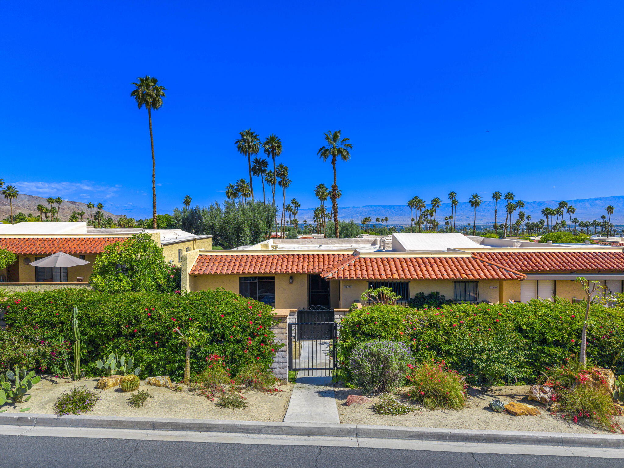 72930 Mesa View Drive Palm Desert, CA 92260 - Photo 11 of 40 a view of a building with potted plants