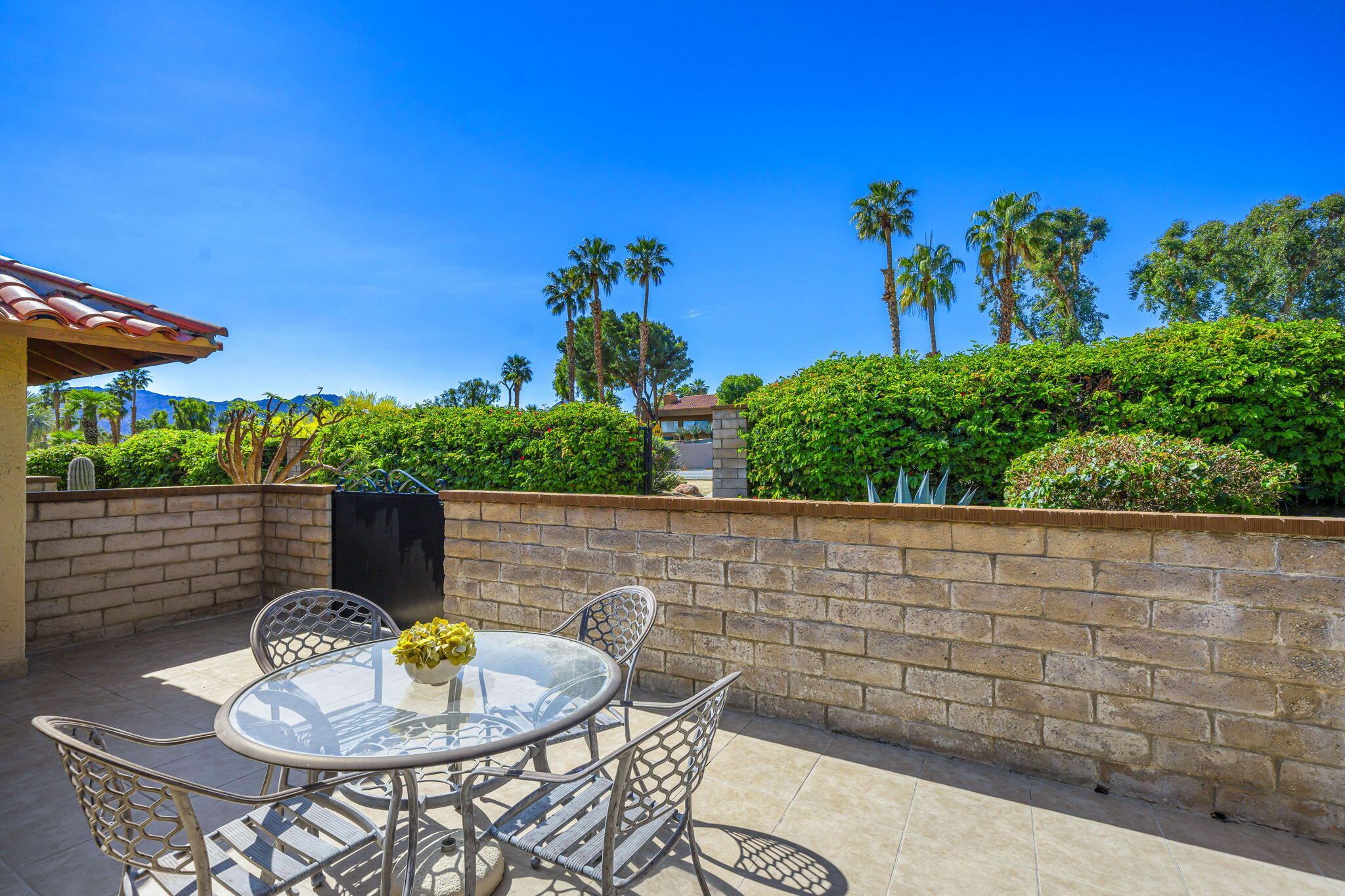 72930 Mesa View Drive Palm Desert, CA 92260 - Photo 14 of 40 a view of house with backyard and sitting area
