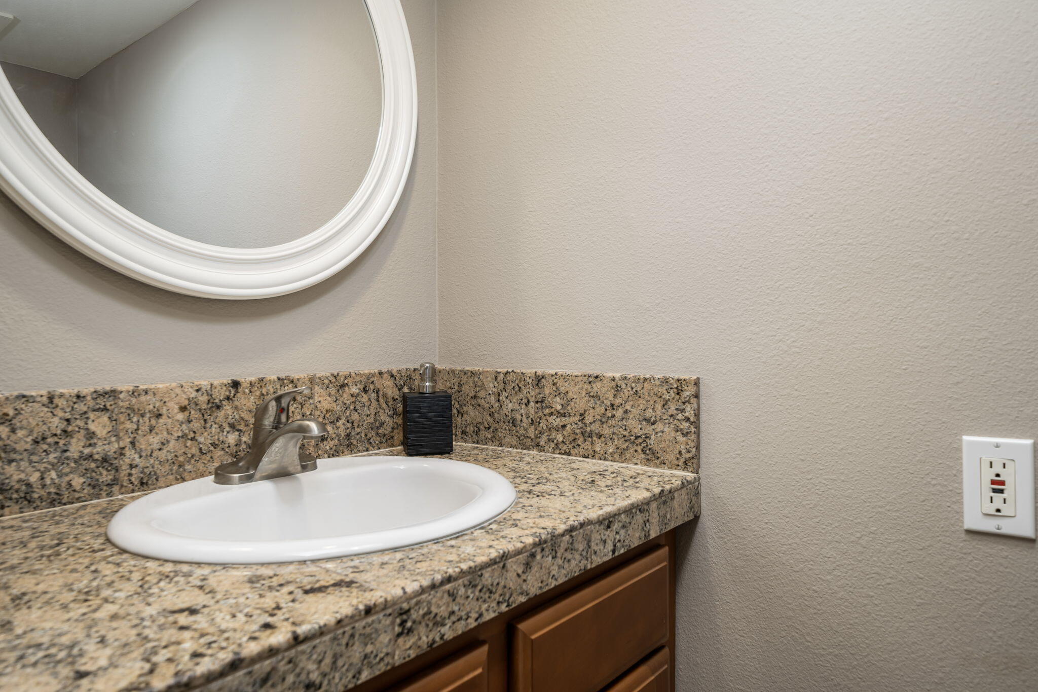 72930 Mesa View Drive Palm Desert, CA 92260 - Photo 29 of 40 a bathroom with a granite countertop sink and a mirror