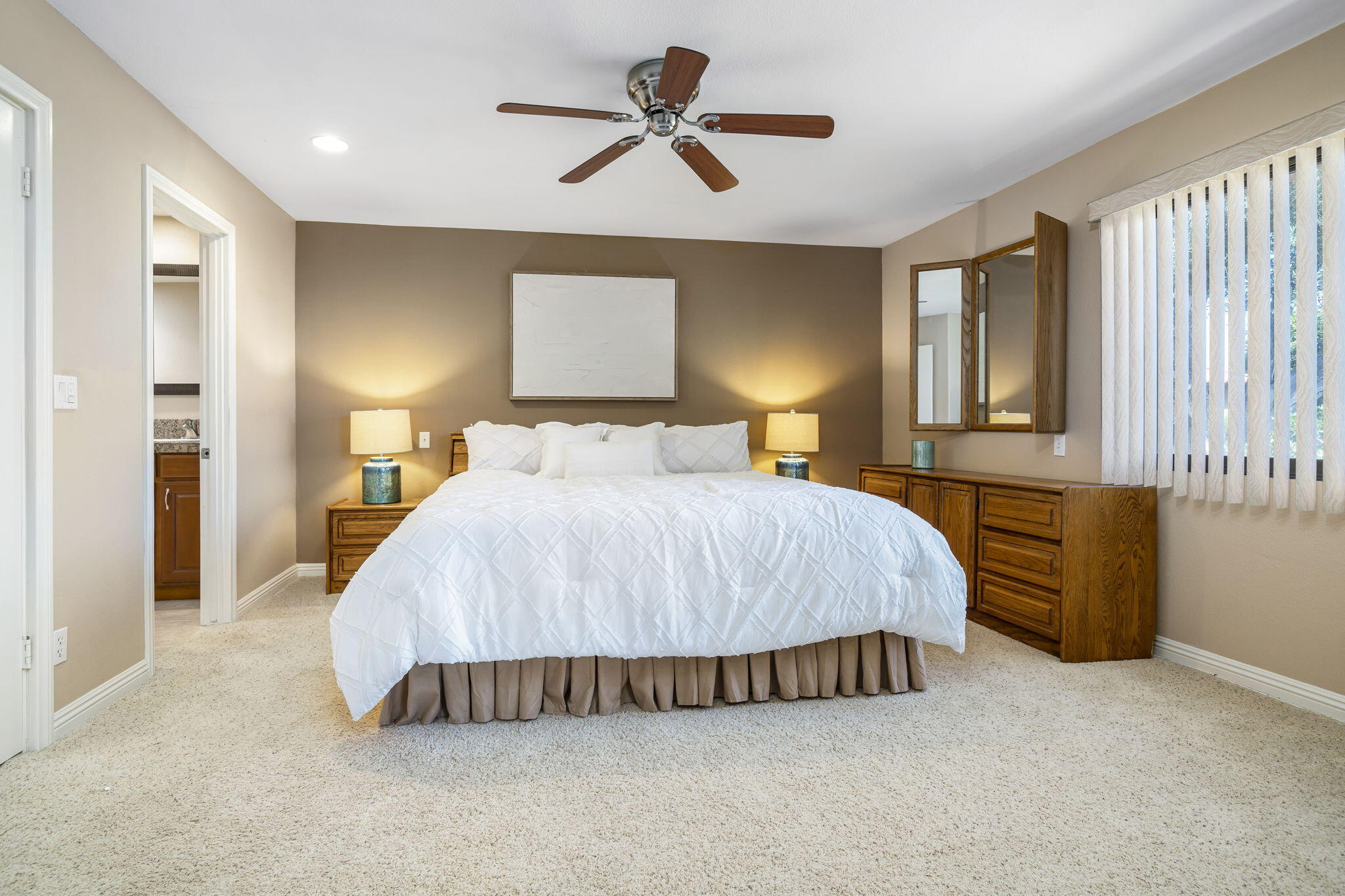 72930 Mesa View Drive Palm Desert, CA 92260 - Photo 30 of 40 a bedroom with a bed and a chandelier