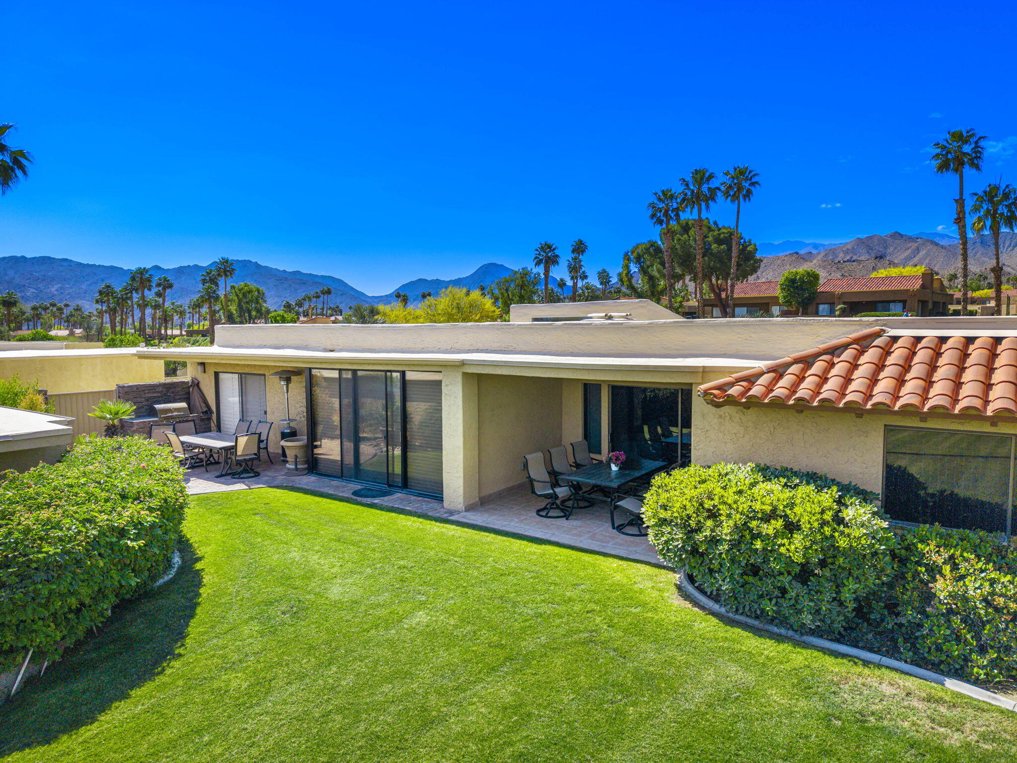 72930 Mesa View Drive Palm Desert, CA 92260 - Photo 37 of 40 a view of a house with garden and a patio