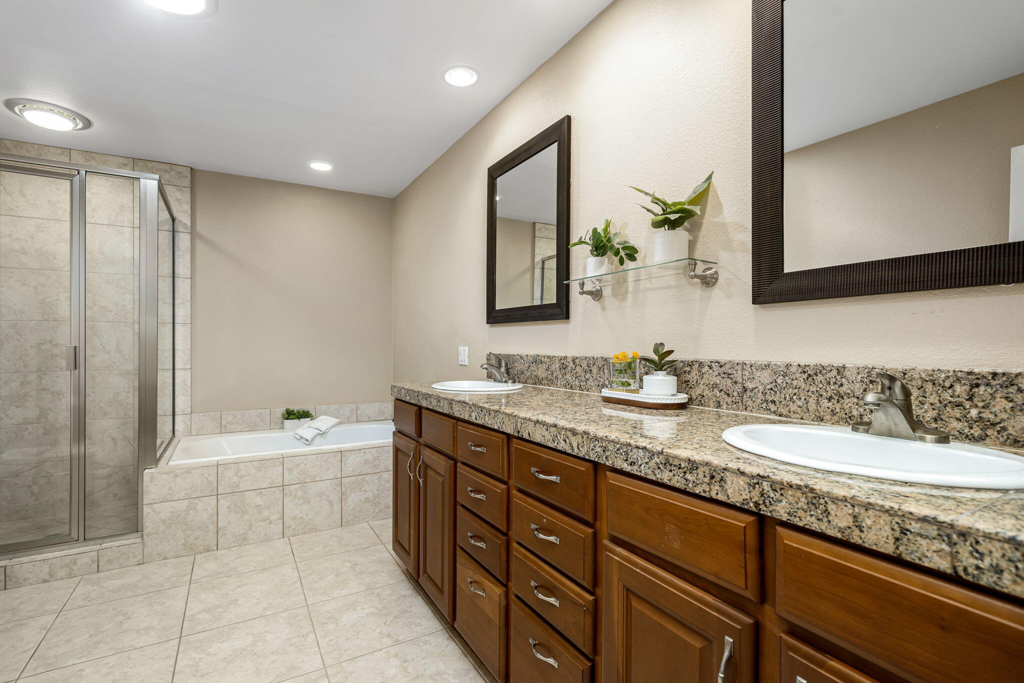 72930 Mesa View Drive Palm Desert, CA 92260 - Photo 10 of 40 a spacious bathroom with a granite countertop sink mirror and bathtub