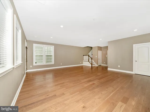 a kitchen with kitchen island granite countertop wooden cabinets and stainless steel appliances