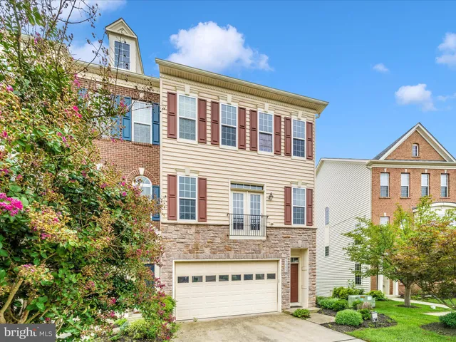 a front view of a building with a garden