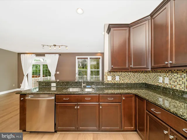 a view of balcony with wooden floor and fence