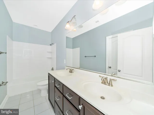 swimming pool view with a garden