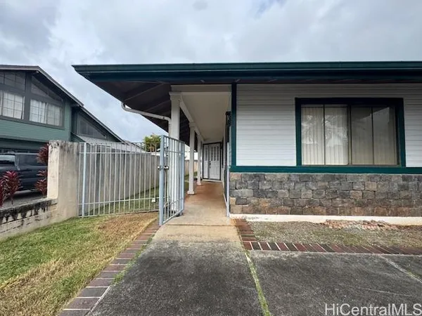a view of entrance gate of house
