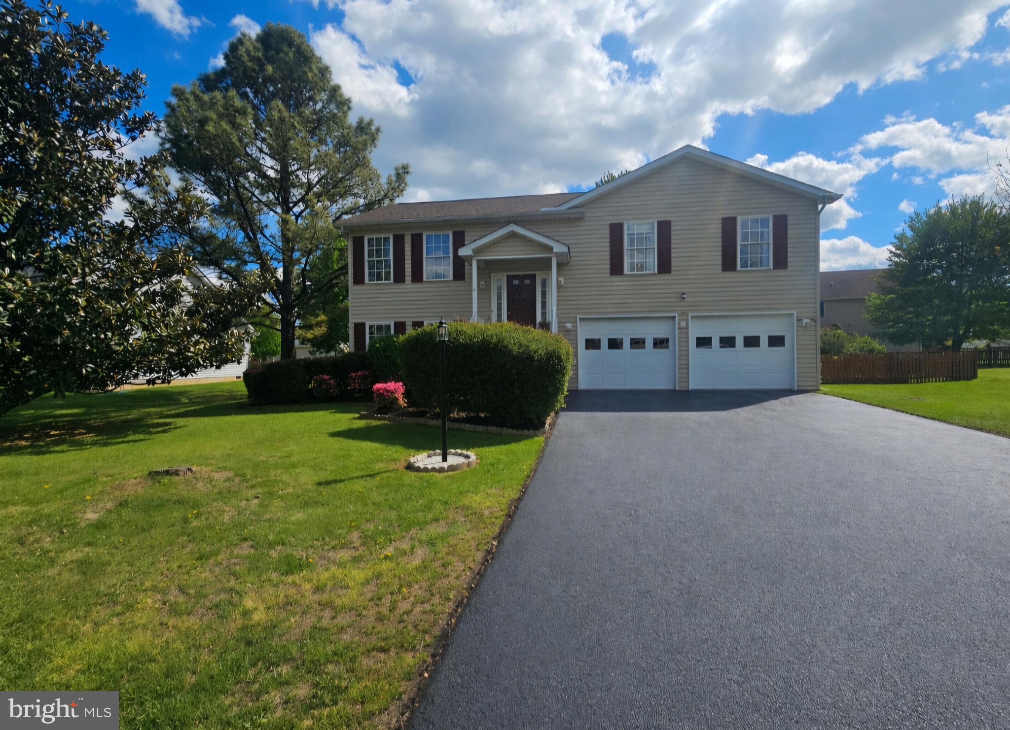61 Clemson Lane Falling Waters, WV 25419 - Photo 1 of 37 a front view of a house with garden