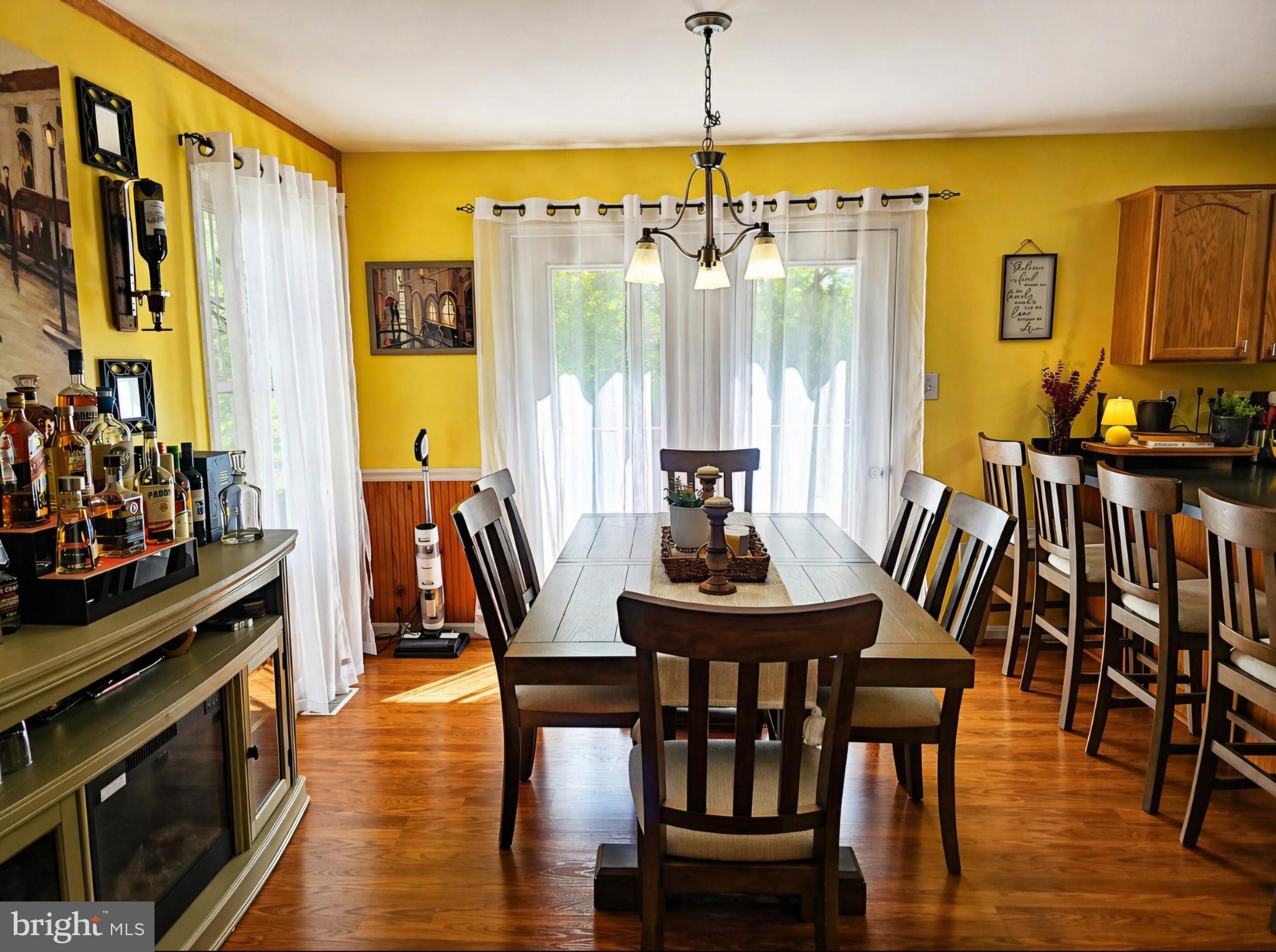 61 Clemson Lane Falling Waters, WV 25419 - Photo 11 of 37 a view of a dining room with furniture window and wooden floor