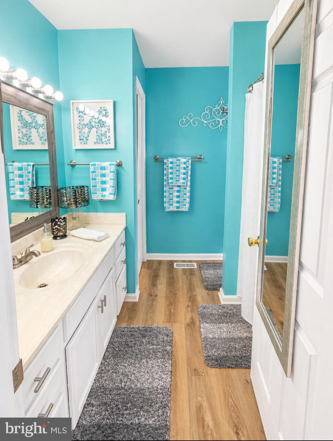 61 Clemson Lane Falling Waters, WV 25419 - Photo 18 of 37 a spacious bathroom with a sink and a large mirror