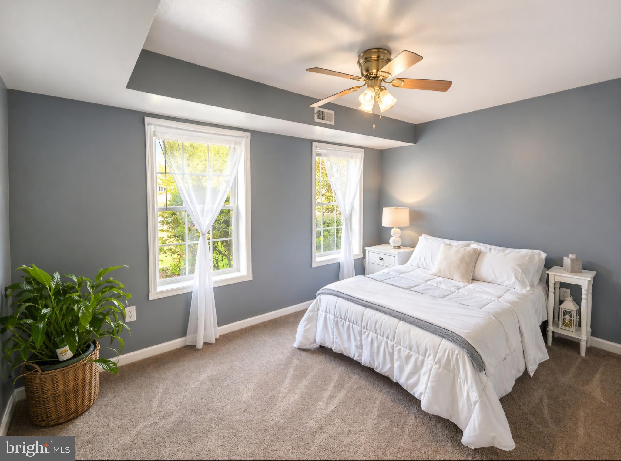 61 Clemson Lane Falling Waters, WV 25419 - Photo 27 of 37 a spacious bedroom with a bed and a ceiling fan