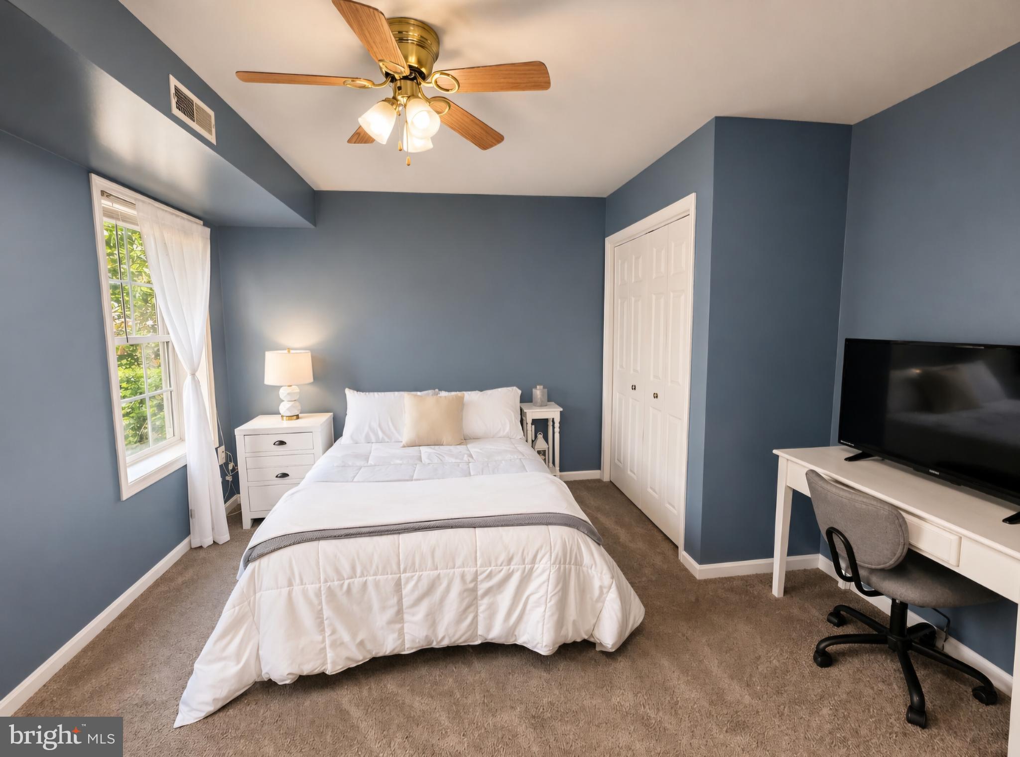 61 Clemson Lane Falling Waters, WV 25419 - Photo 28 of 37 a bedroom with a bed and a window
