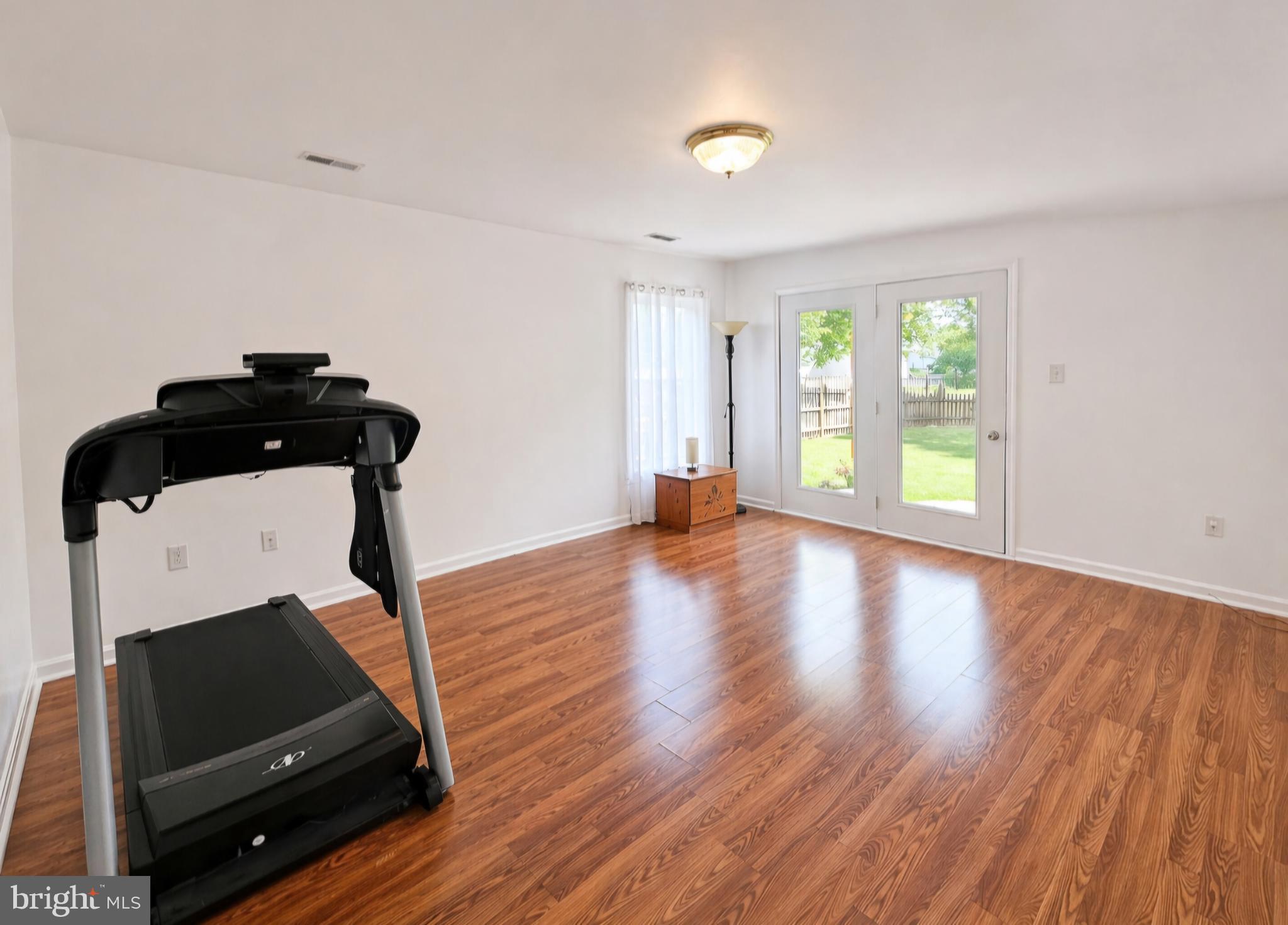 61 Clemson Lane Falling Waters, WV 25419 - Photo 29 of 37 wooden floor in an empty room with a window