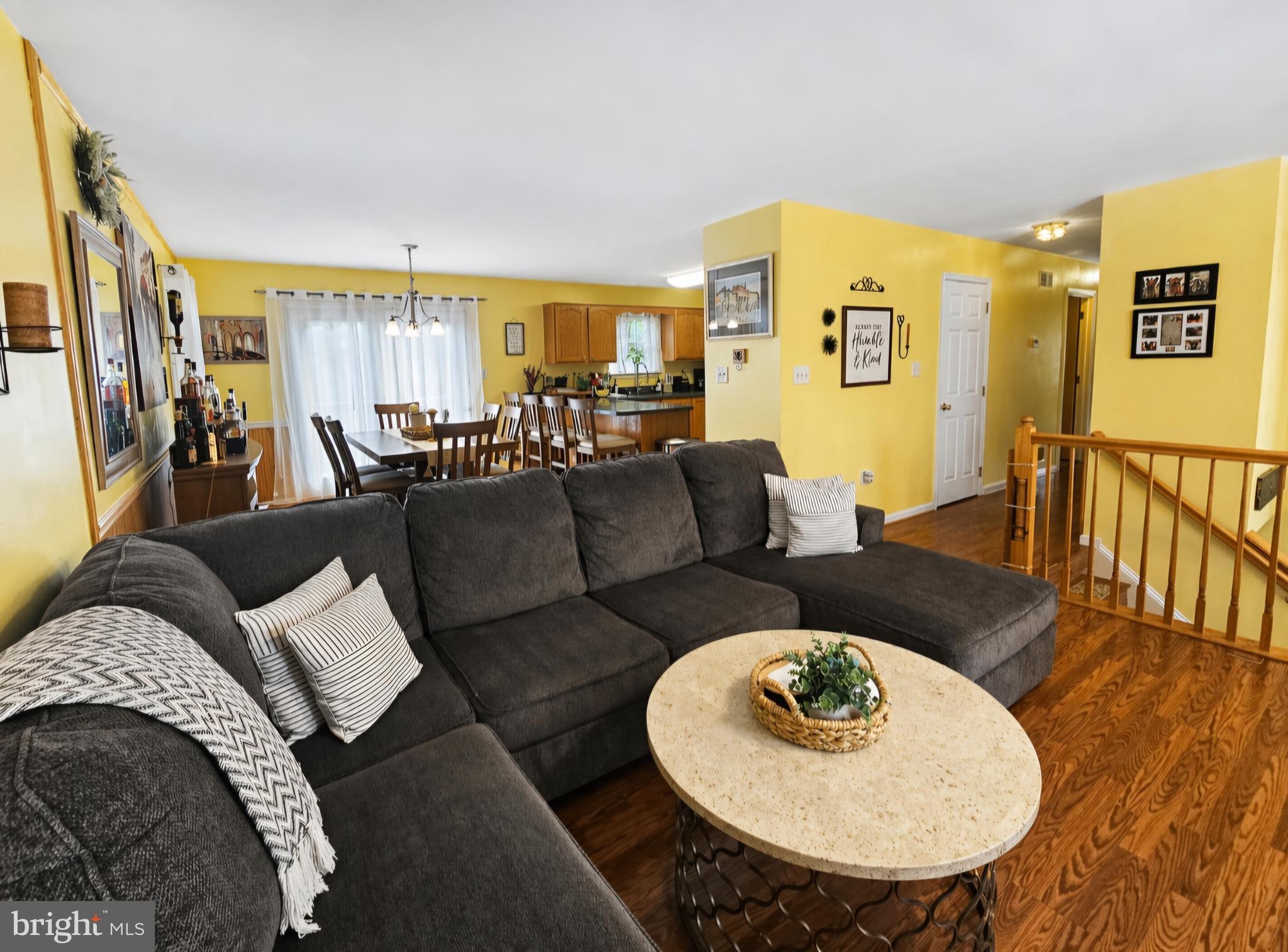 61 Clemson Lane Falling Waters, WV 25419 - Photo 5 of 37 a living room with furniture and a wooden floor