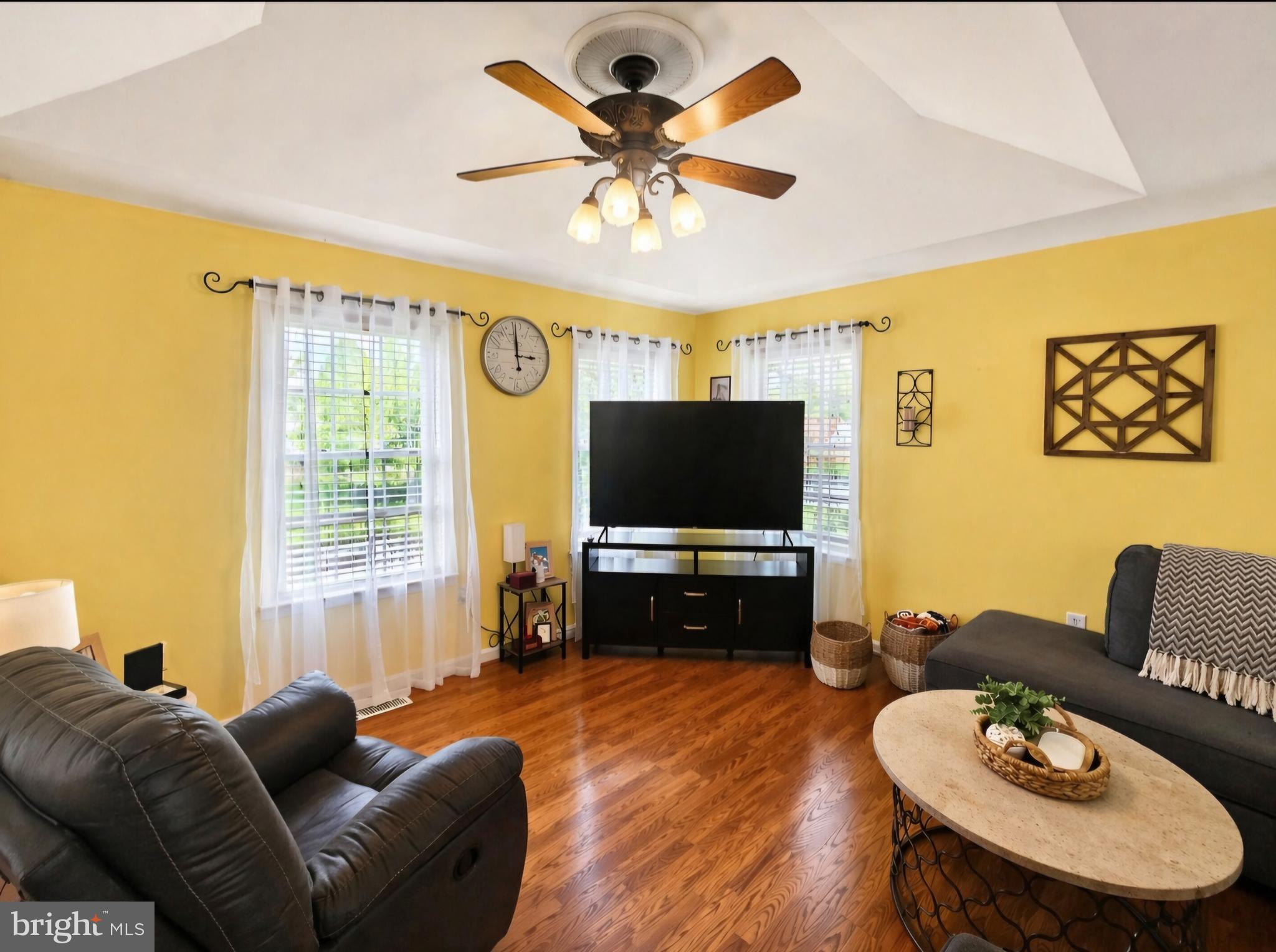 61 Clemson Lane Falling Waters, WV 25419 - Photo 6 of 37 a living room with furniture and a flat screen tv
