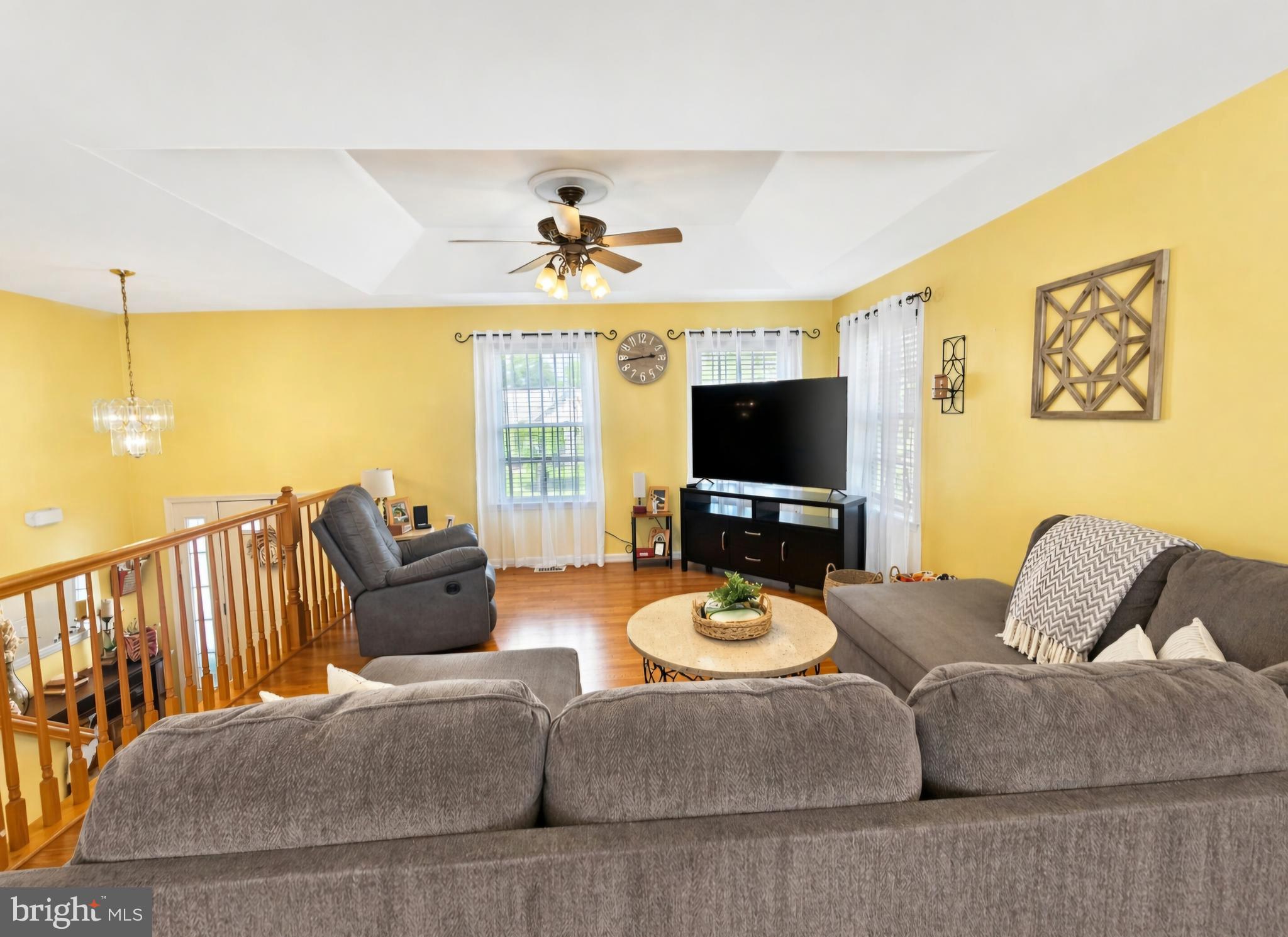 61 Clemson Lane Falling Waters, WV 25419 - Photo 8 of 37 a living room with furniture and a flat screen tv