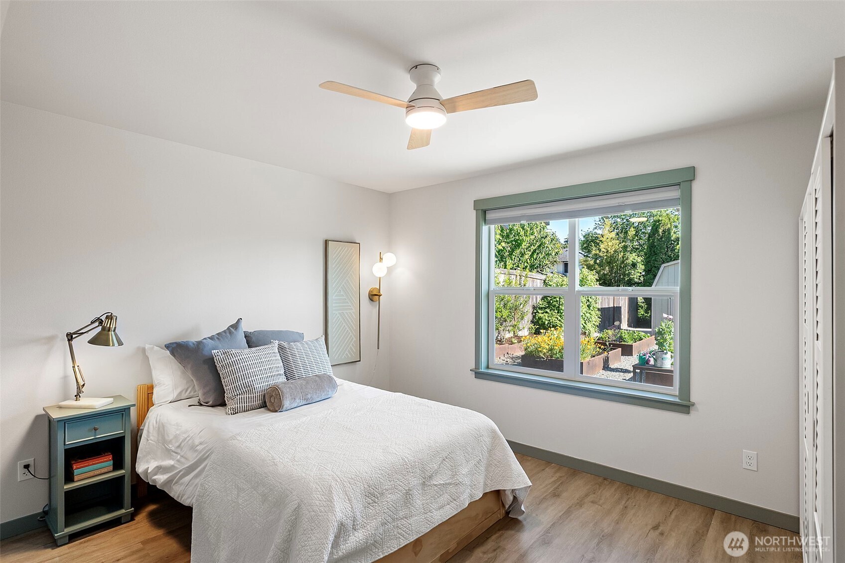503 5th Street Steilacoom, WA 98388 - Photo 17 of 40 a bedroom with a large bed and a window