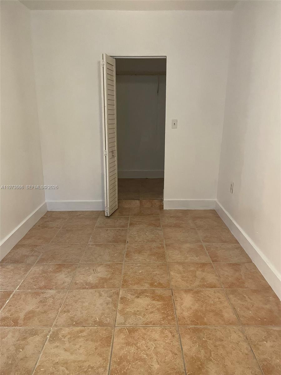 746 Northeast 80th Street, Unit E2 Miami, FL 33138 - Photo 4 of 9 an empty room with a empty space