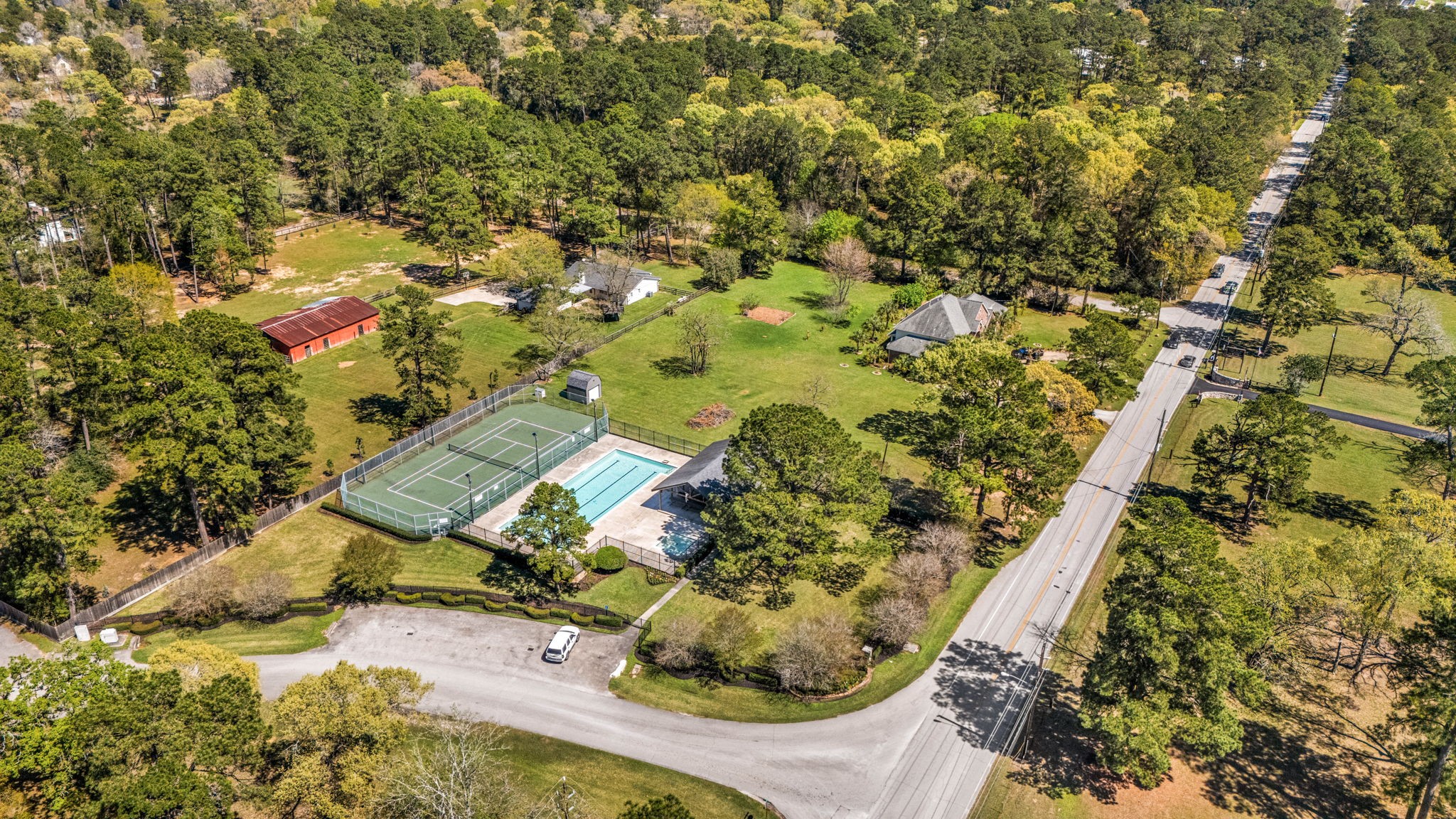 14419 Timbergreen Drive Magnolia, TX 77355 - Photo 39 of 43 Enjoy access to community amenities including a swimming pool and tennis courts, perfect for relaxing weekends and outdoor activities.
