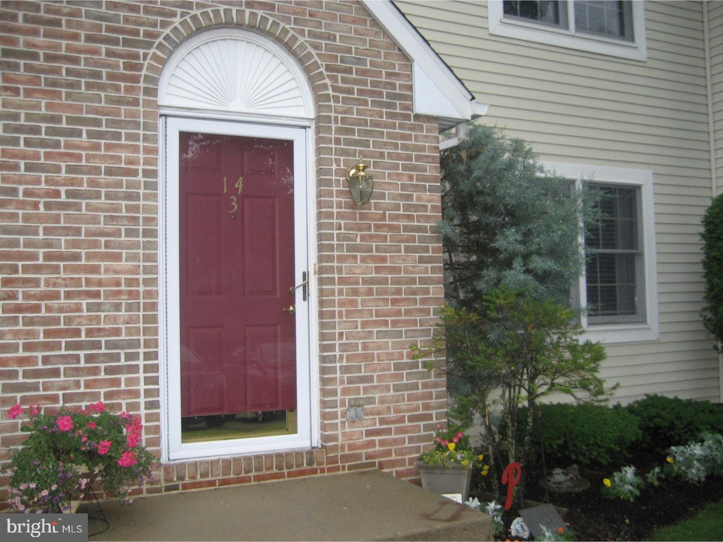 14-4 Cranberry Ridge, Unit 3 Reading, PA 19606 - Photo 1 of 24 a front view of a house with a garden