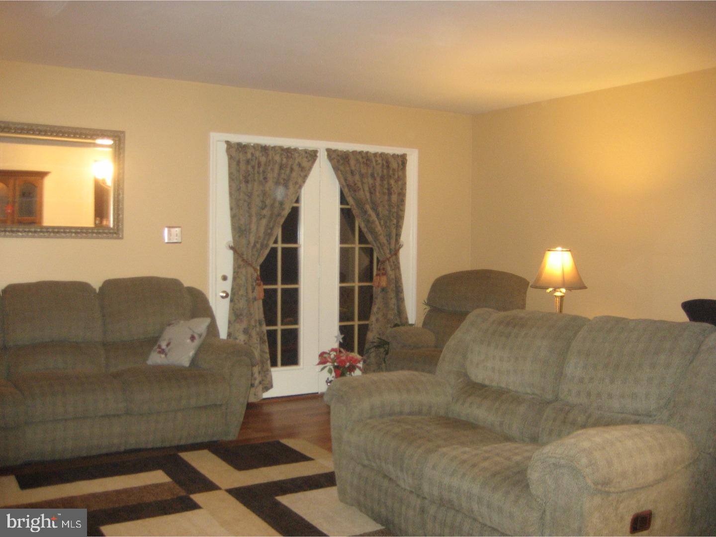 14-4 Cranberry Ridge, Unit 3 Reading, PA 19606 - Photo 12 of 24 a living room with furniture and a lamp