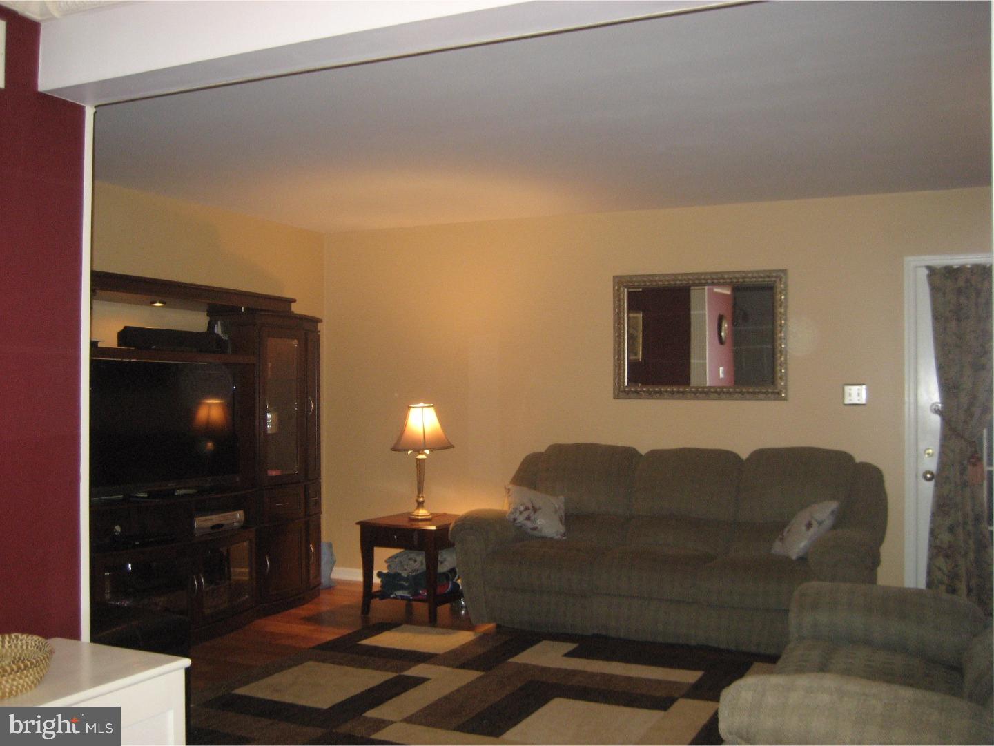 14-4 Cranberry Ridge, Unit 3 Reading, PA 19606 - Photo 13 of 24 a living room with furniture and a lamp