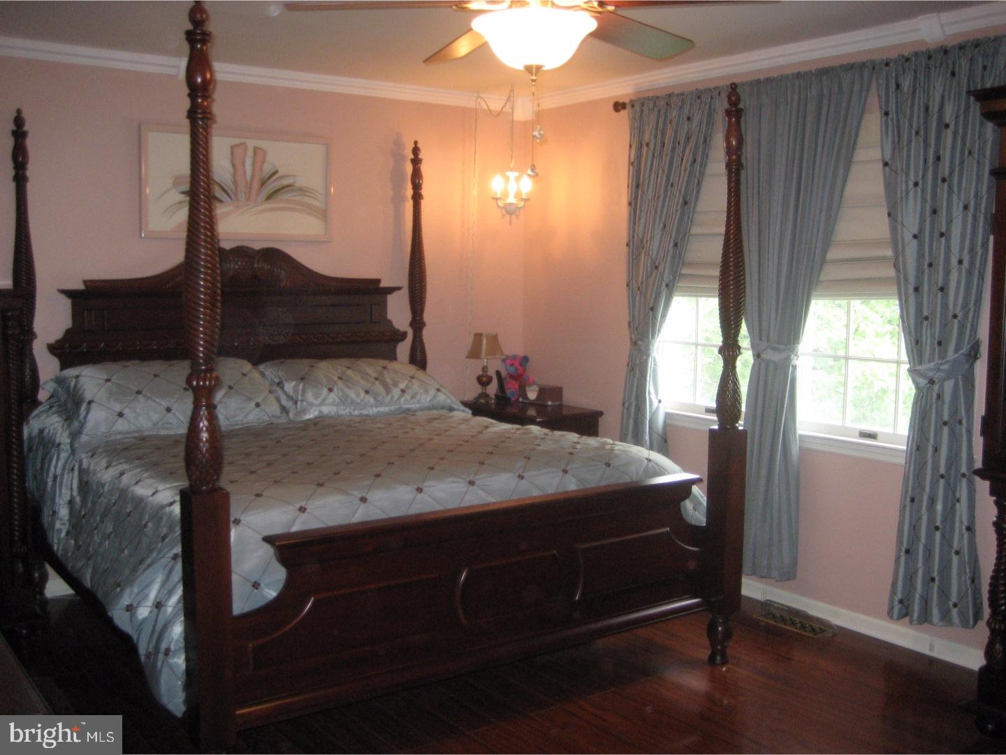 14-4 Cranberry Ridge, Unit 3 Reading, PA 19606 - Photo 15 of 24 a bedroom with a bed and a chandelier