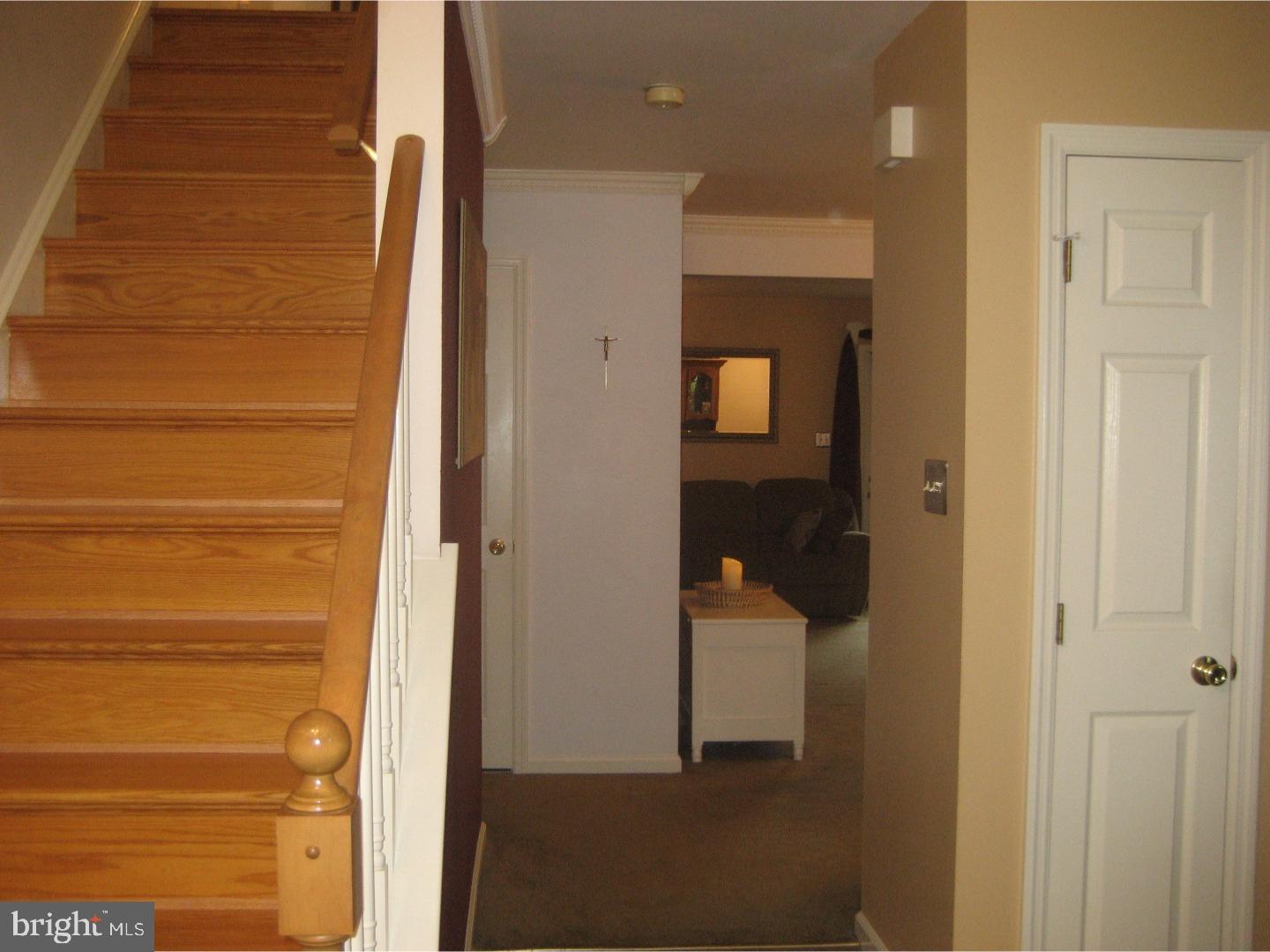 14-4 Cranberry Ridge, Unit 3 Reading, PA 19606 - Photo 3 of 24 a view of a hallway with wooden floor and staircase