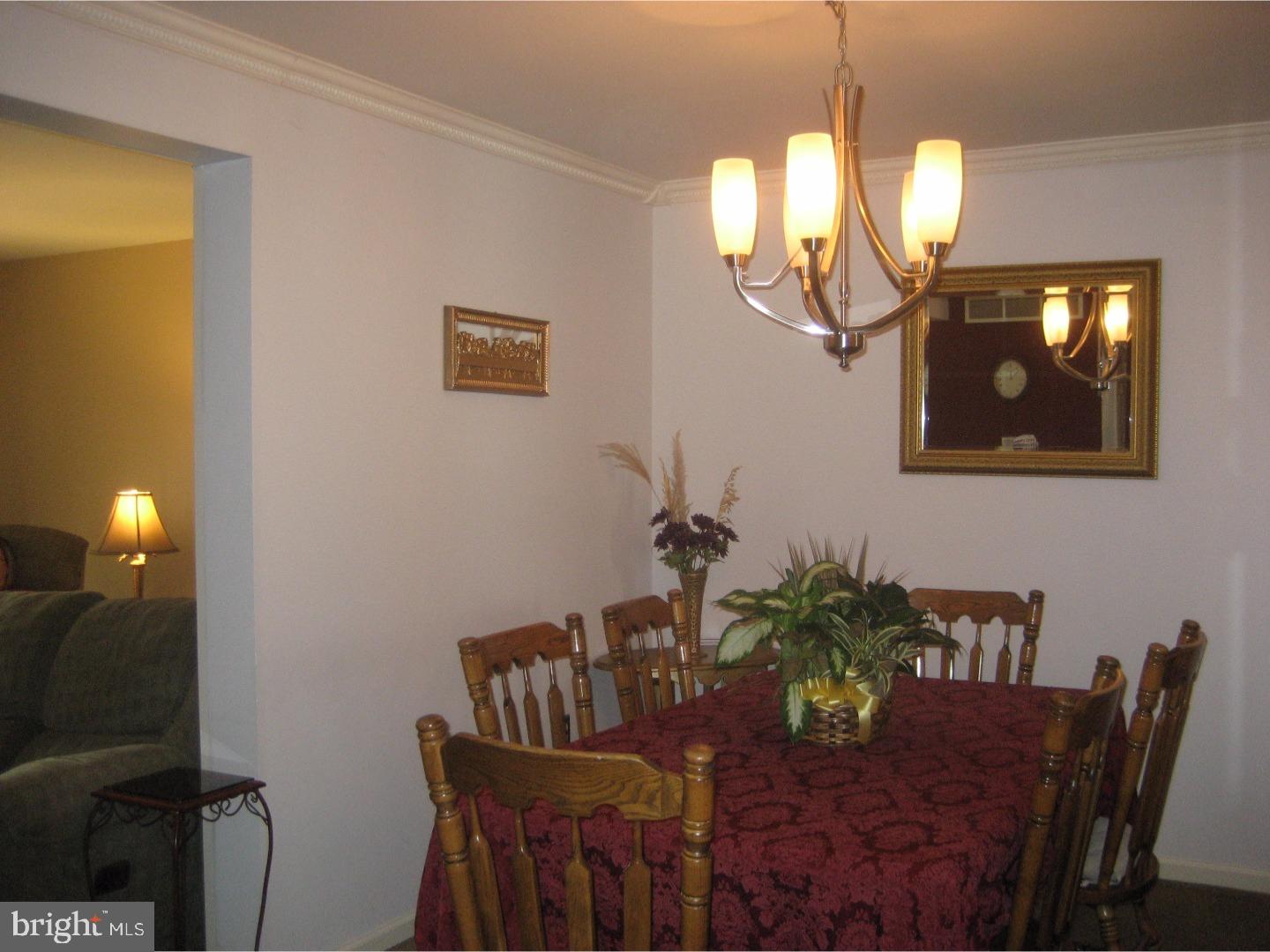 14-4 Cranberry Ridge, Unit 3 Reading, PA 19606 - Photo 7 of 24 a view of a dining room with furniture and chandelier