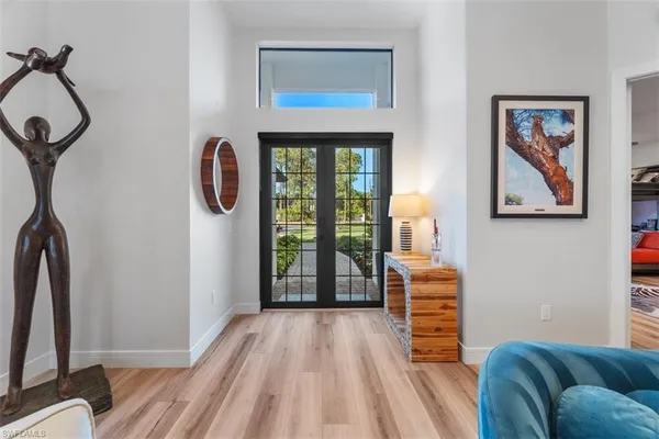 a bedroom with furniture and a window