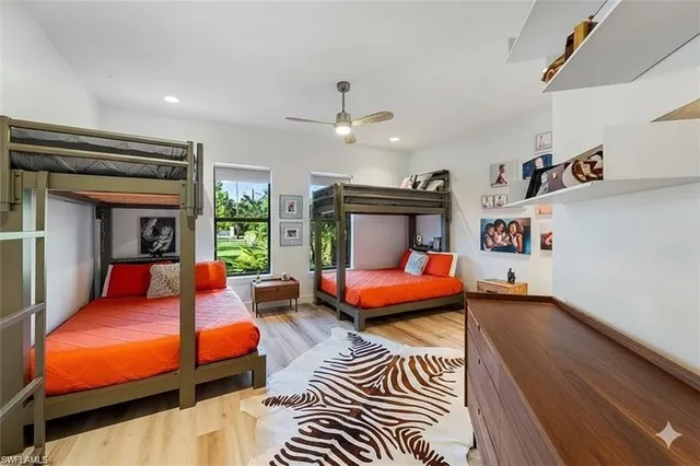 a bedroom with furniture and a chandelier