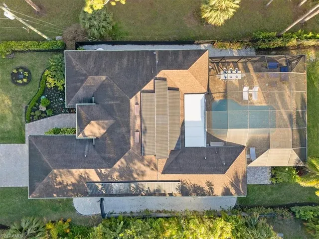an aerial view of a house with outdoor space