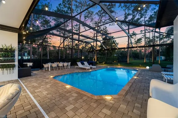 a view of a swimming pool with a patio