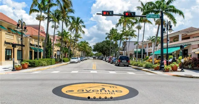 an outdoor space with lots of tables and chairs