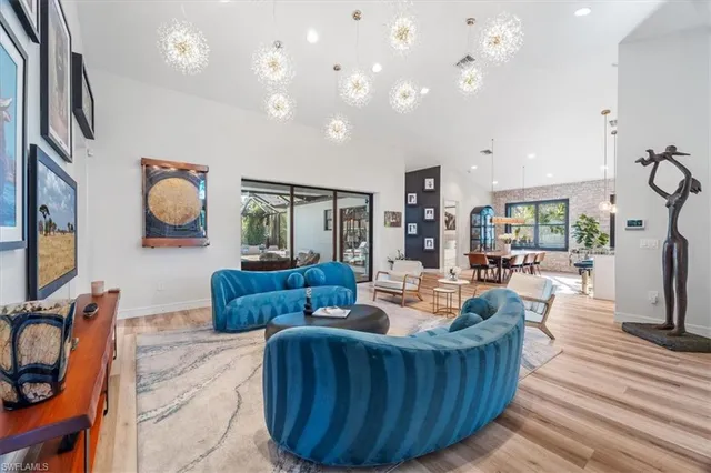 a living room with furniture a rug and a flat screen tv