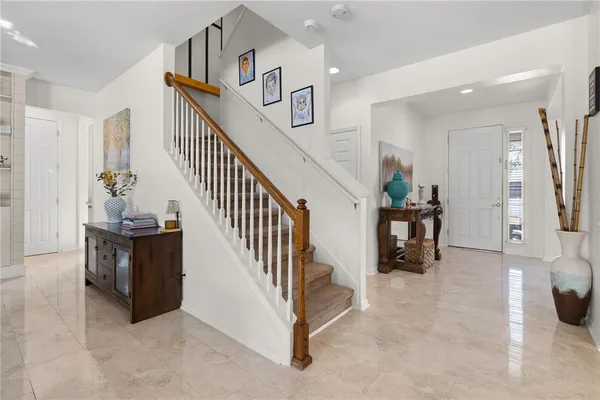 a kitchen with stainless steel appliances granite countertop a sink and a refrigerator