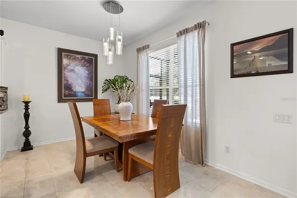 a living room with a fireplace and a flat screen tv