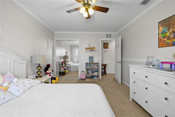 a bedroom with furniture and a chandelier