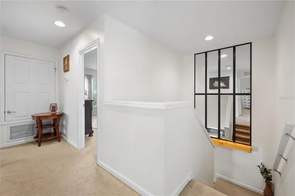 a spacious bedroom with a bed and a window