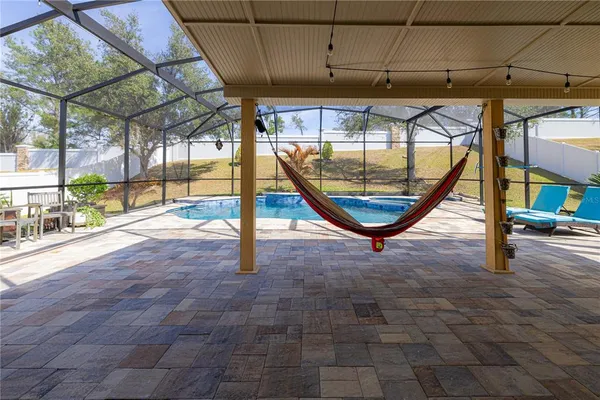 a view of a swimming pool with a patio
