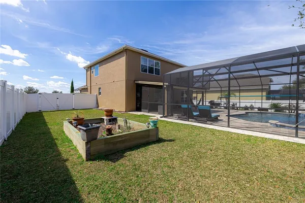a white house with a large tree in front of it