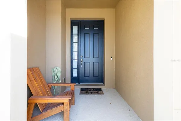 a view of chair and table in a room
